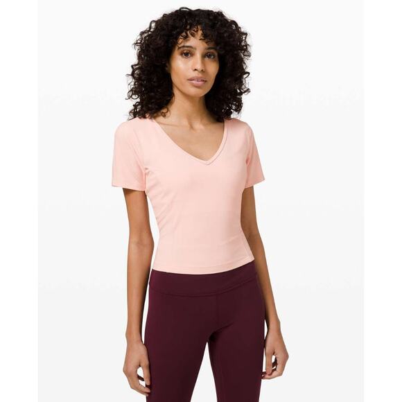 (4) $68 Lululemon Nulu Cropped Slim Yoga Short Sleeve Pink Mist - Picture 1 of 8